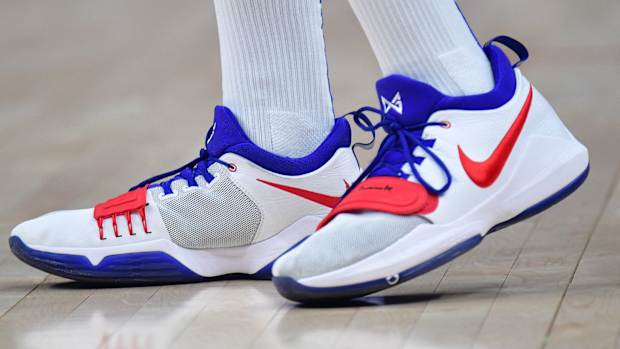 Los Angeles Clippers forward Paul George's white, red, and blue Nike sneakers.